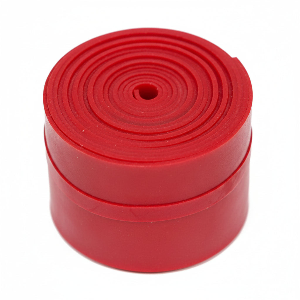 Red tape floss band roll on a white background