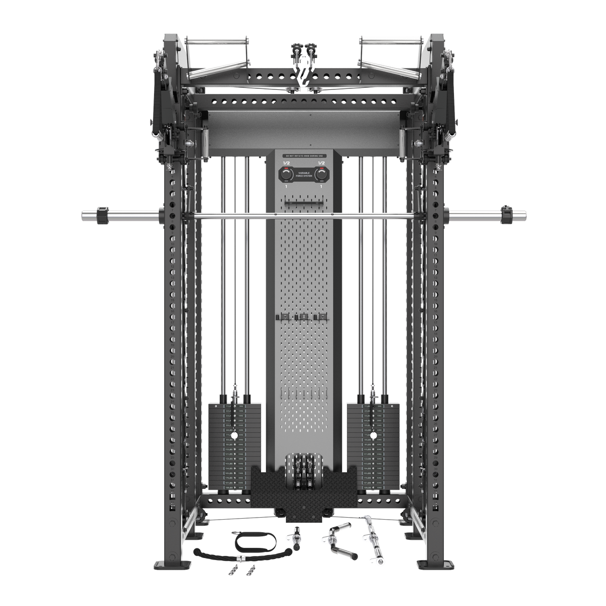 A large black and gray cable pulley gym machine with a barbell resting horizontally across the top, shown on a plain white background. Small accessory pieces are placed on the floor in front.