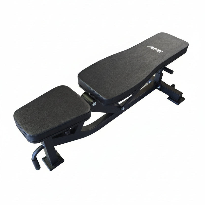 Black adjustable weight bench on a wooden floor in a gym setting