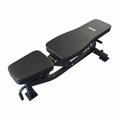 Black adjustable weight bench on a wooden floor in a gym setting