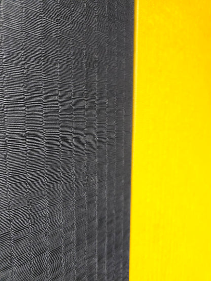Close-up of textured black and yellow surface