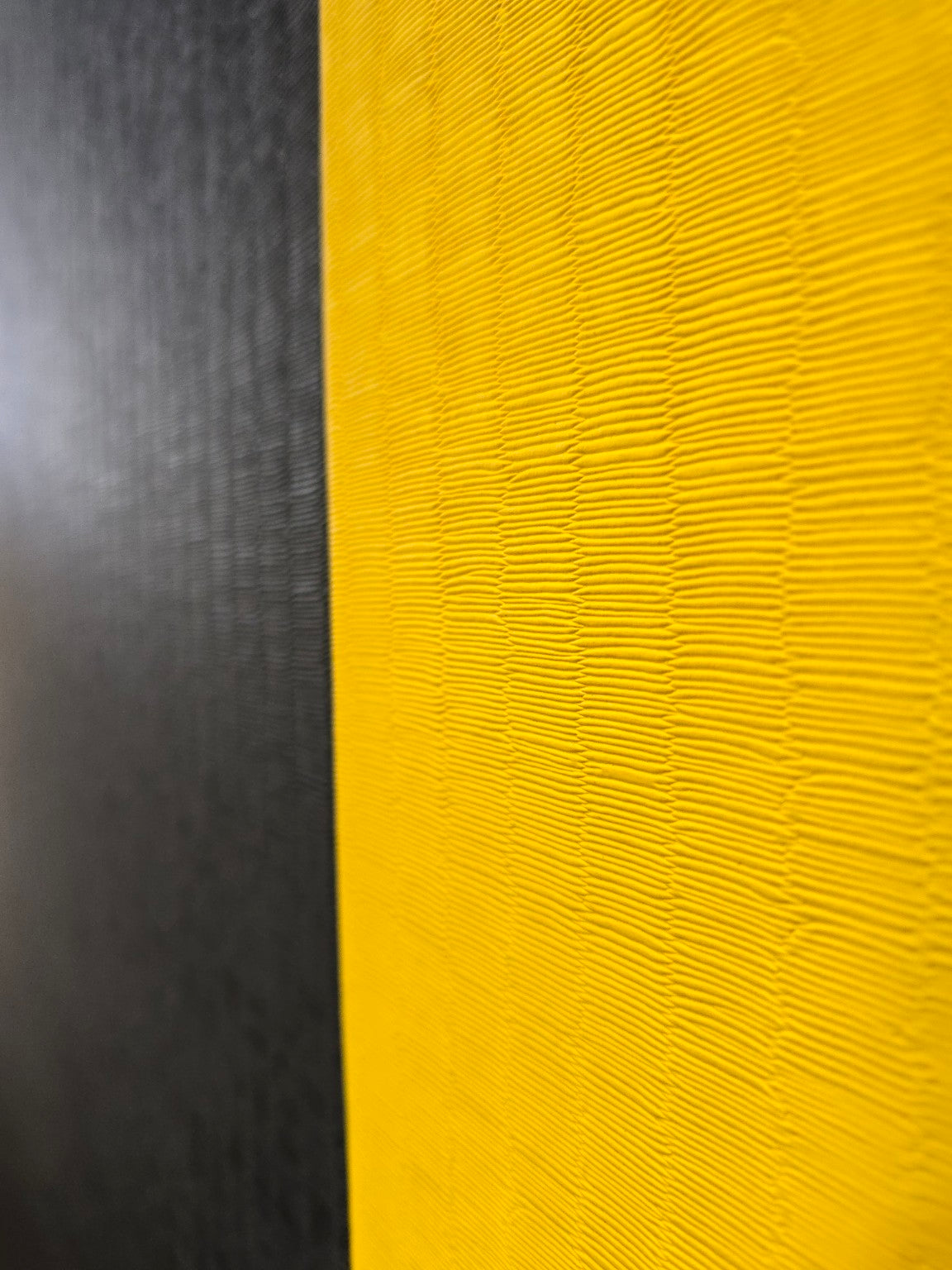 Close-up of textured black and yellow surface