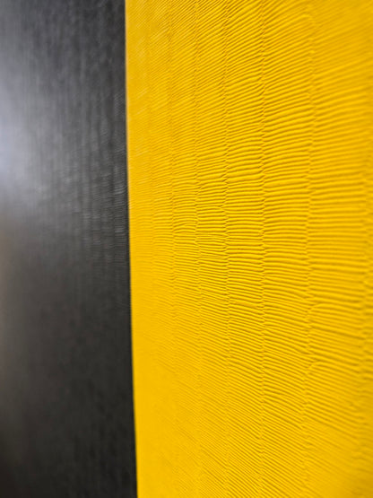 Close-up of textured black and yellow surface