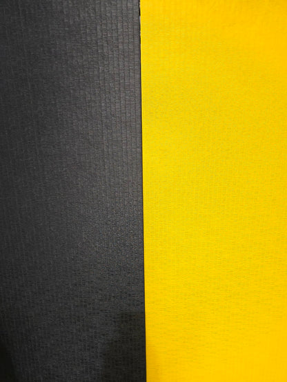 Two-tone fabric swatch with black and yellow sections