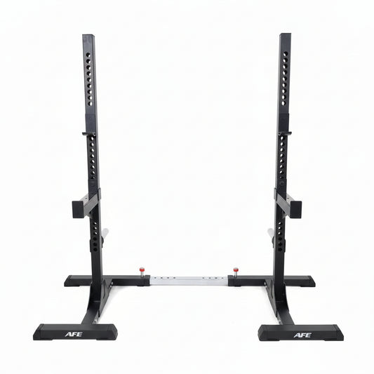 A black AFE power rack with a white fabric backdrop hanging between the uprights, set in a gym with wood-look flooring and exercise equipment in the background.