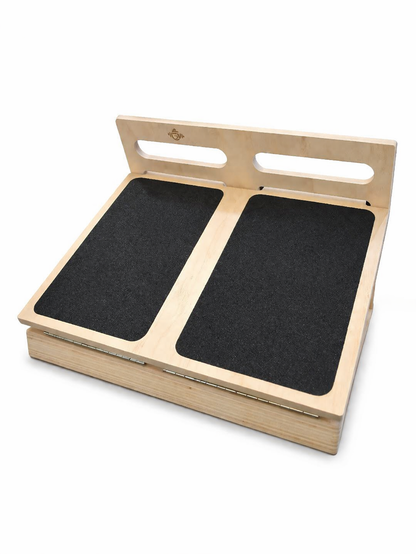 Wooden platform with two black mats on a white background
