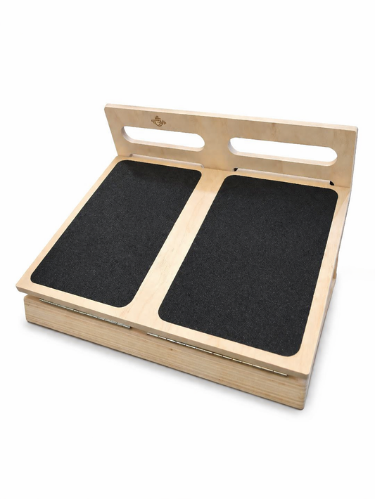 Wooden platform with two black mats on a white background